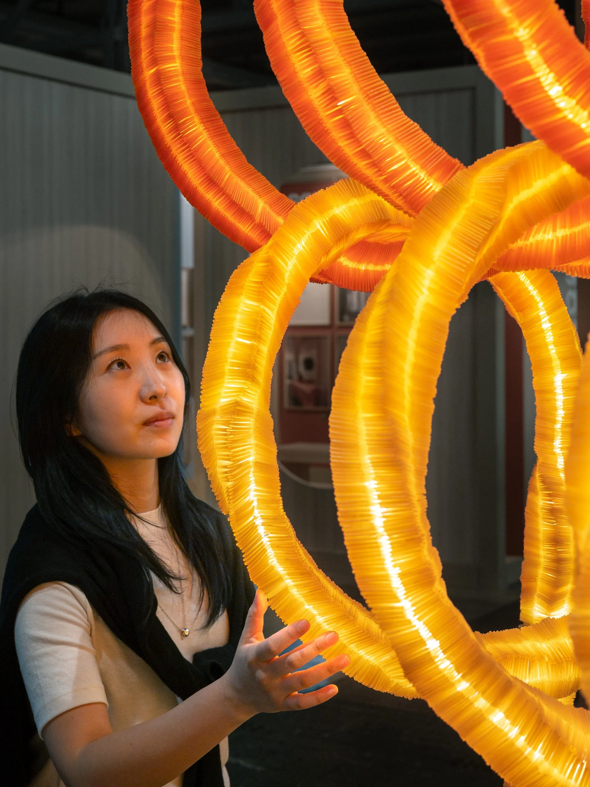 Seaweed-based biodegradable material shapes two interlocking tubular light installations | Designboom