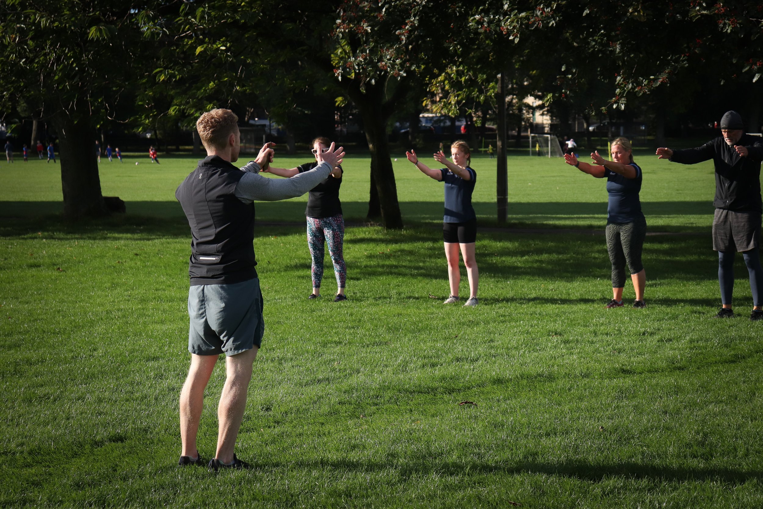 Personal Trainer, Gregor Ridley instructs a group of people during his Saturday morning Robust Running Club at The Meadows park in Edinburgh.