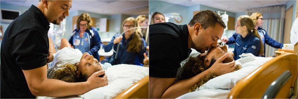 Pregnant mother in labor is comforted by supportive husband during hospital birth, Philadelphia Photographer
