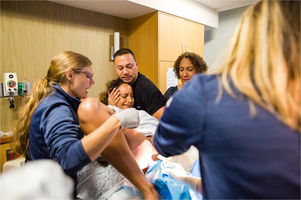 Pregnant mama in labor pushes during hospital delivery, Philadelphia Birth Photographer