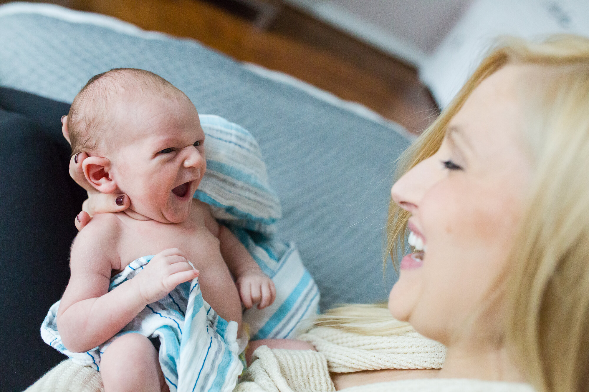 Two week old baby boy has a big smile for his happy mommy, Philadelphia Newborn Photographer