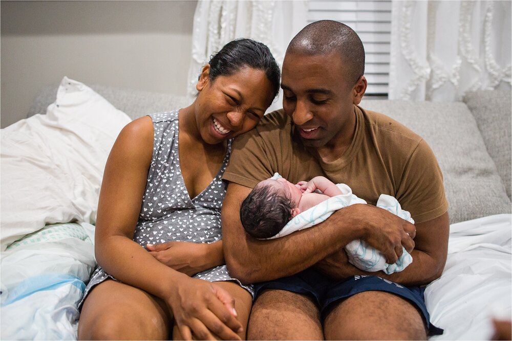 Portrait of black mom and dad with newborn baby boy, home birth Photographer Philadelphia