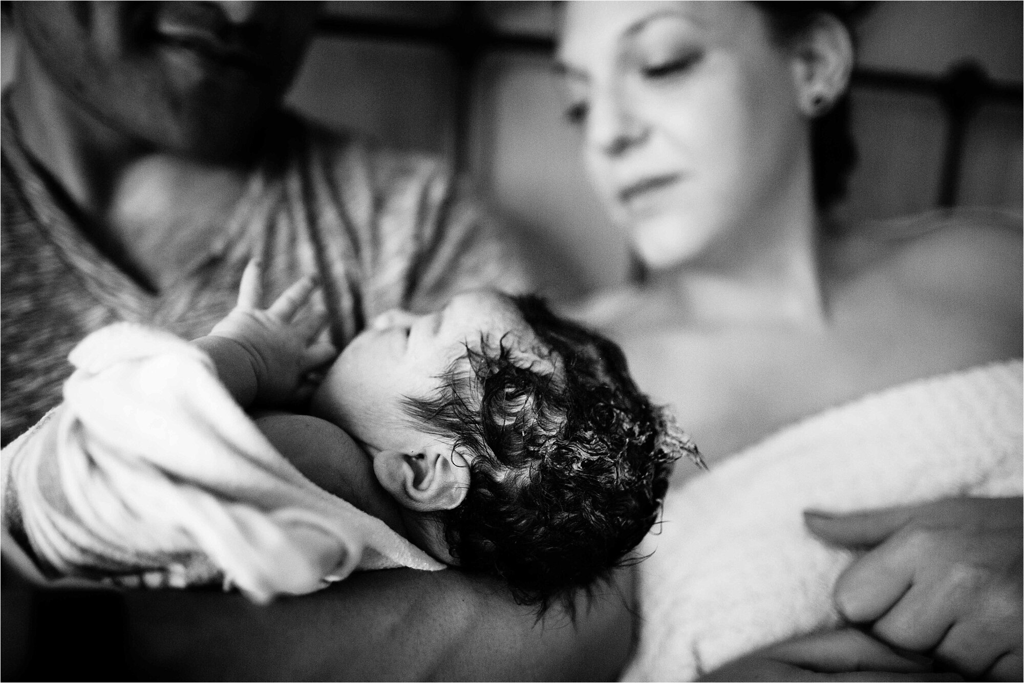 New mother and father admire their new baby boy, Philadelphia birth center photography