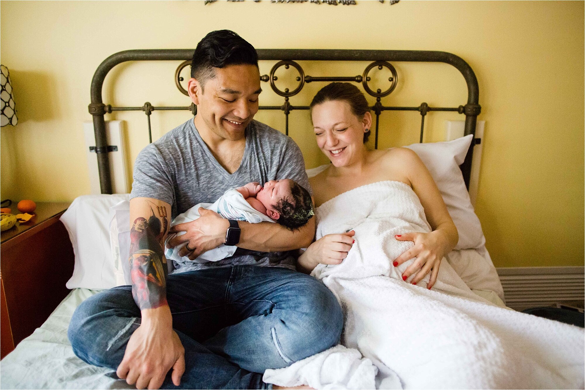 Mom and dad laugh together after their son is born, Philadelphia birth center photographer