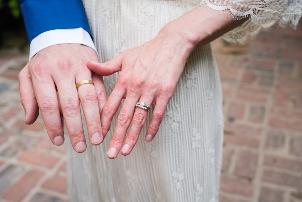 Bride and groom show off their wedding rings after getting married, Philadelphia photographer