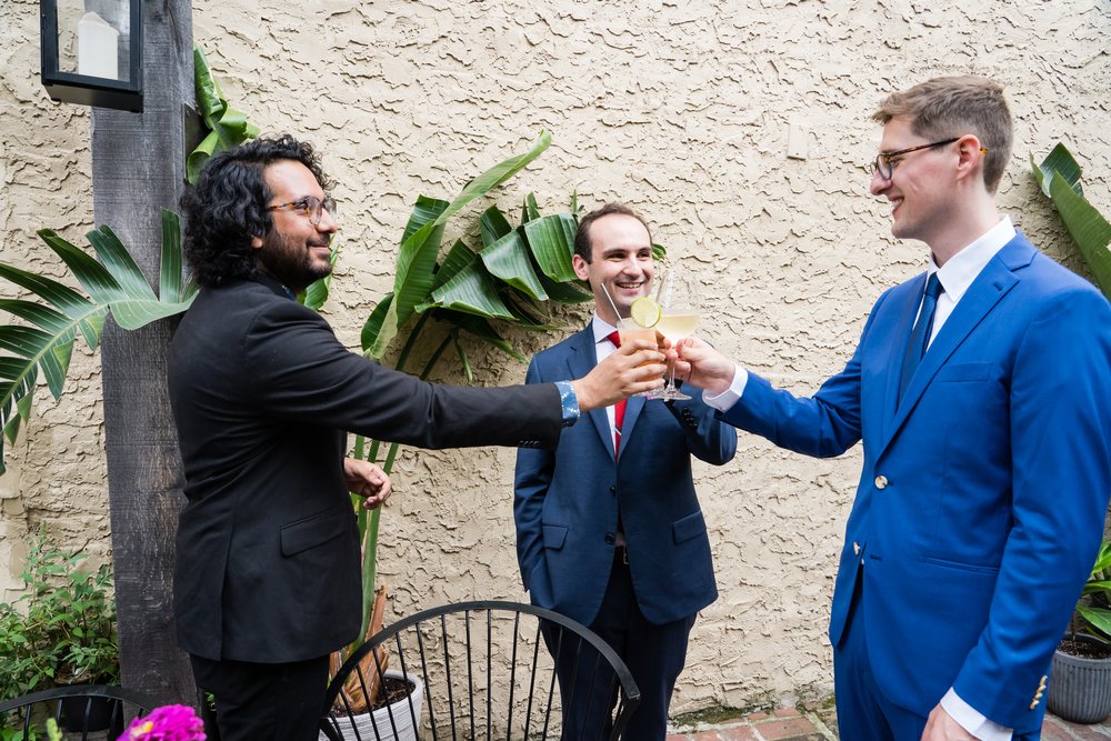 Groom and friends share a drink and cheers, Philadelphia wedding photography