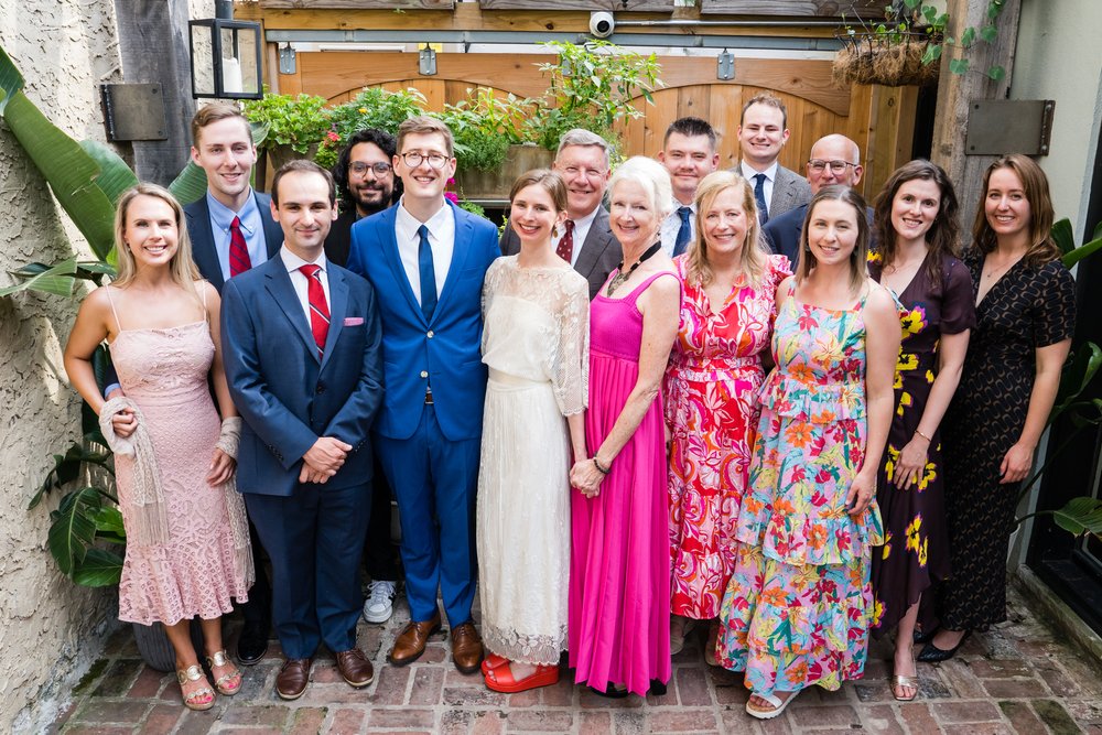 Group photo of all guests at a small wedding with bride and groom at Southwark Restaurant, Philadelphia