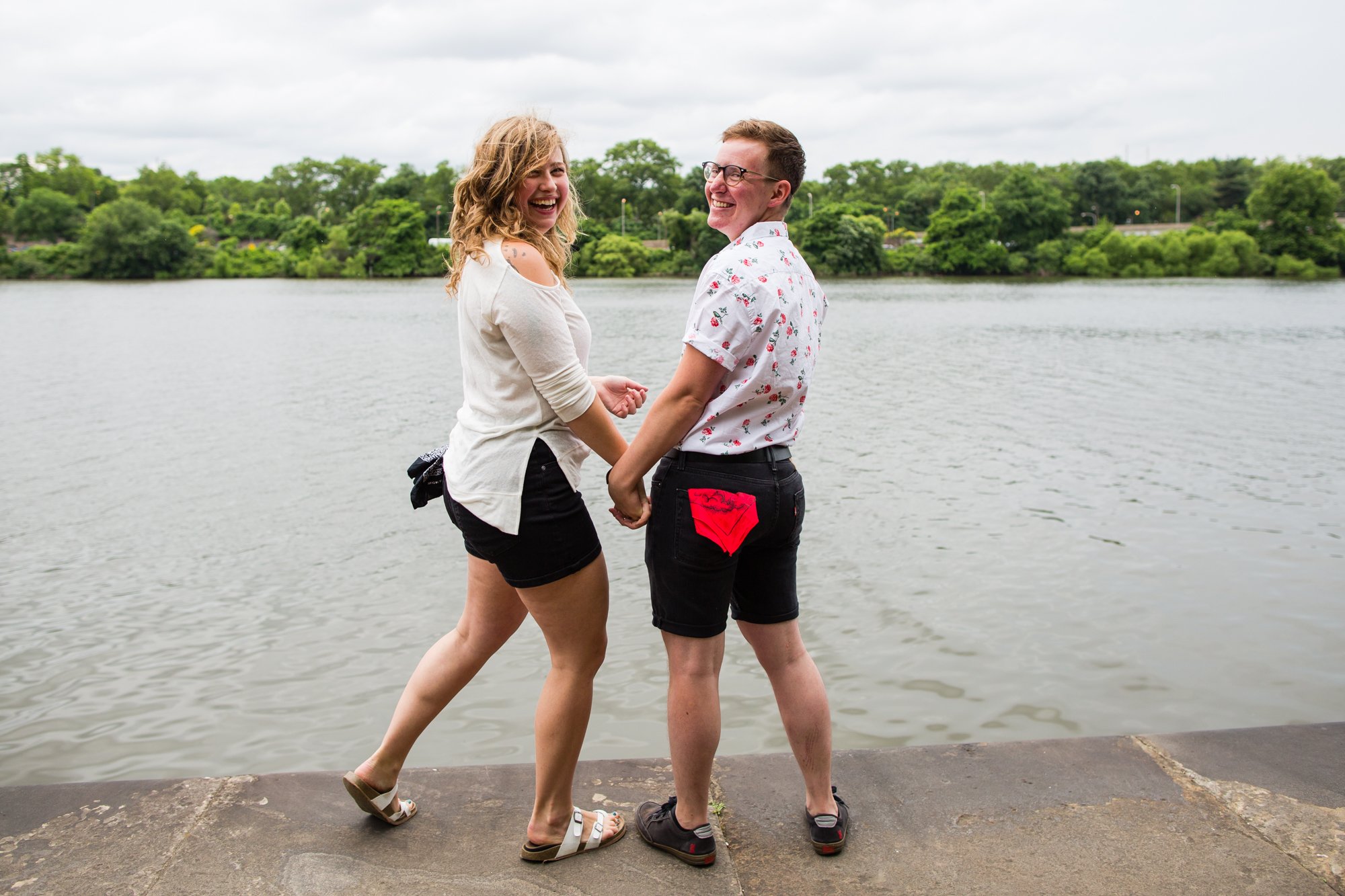 Wedding couple poses by Schuylkill River after eloping, Philadelphia photographer