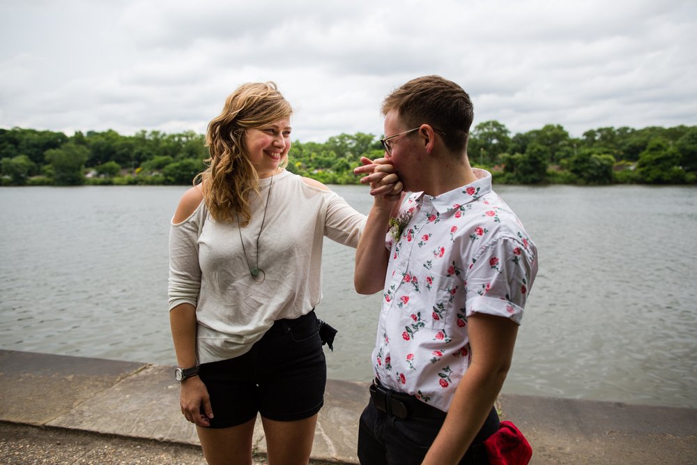 Couple kiss and smile at each other after getting married by Schuylkill River, Philadelphia elopement photographer