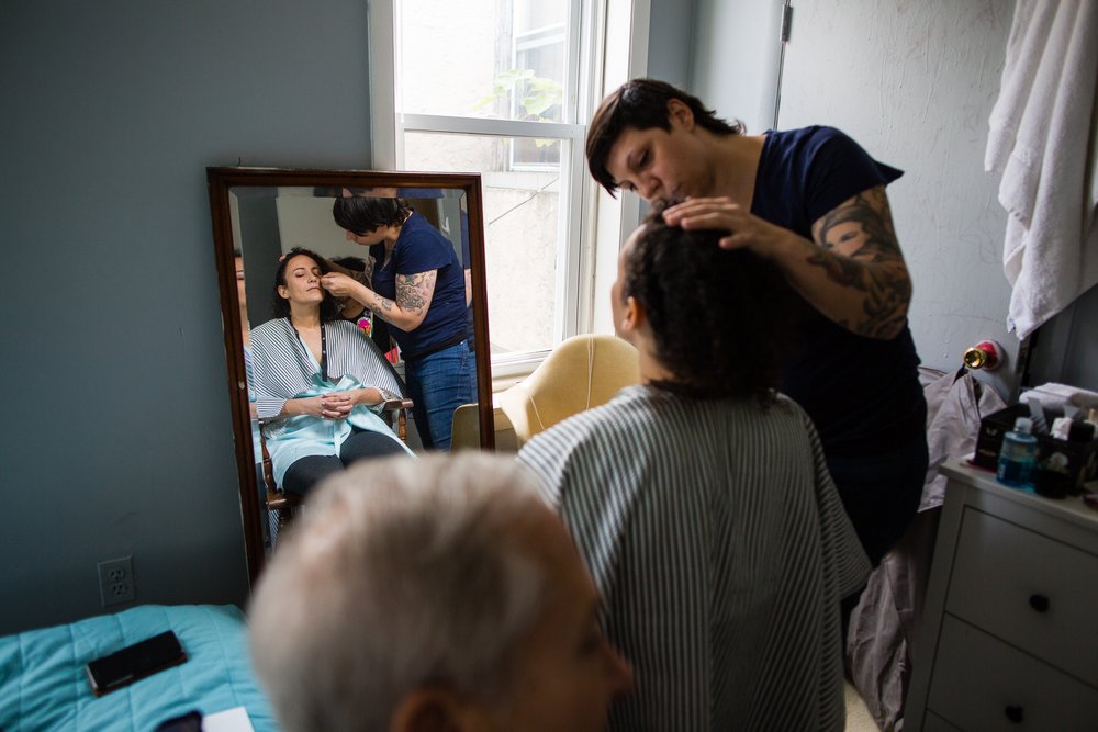 Bride gets makeup done in childhood Philadelphia home, wedding documentary photographer