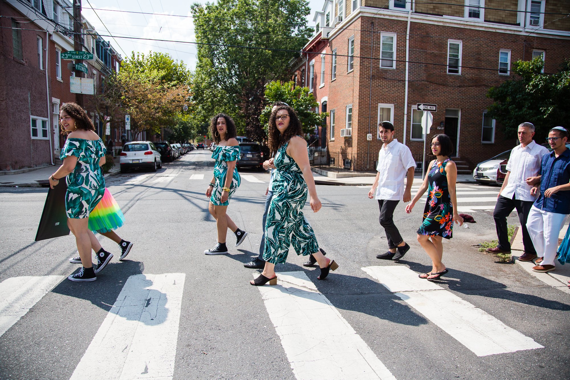 Wedding party crosses south philly street, abbey road portrait, documentary wedding photographer