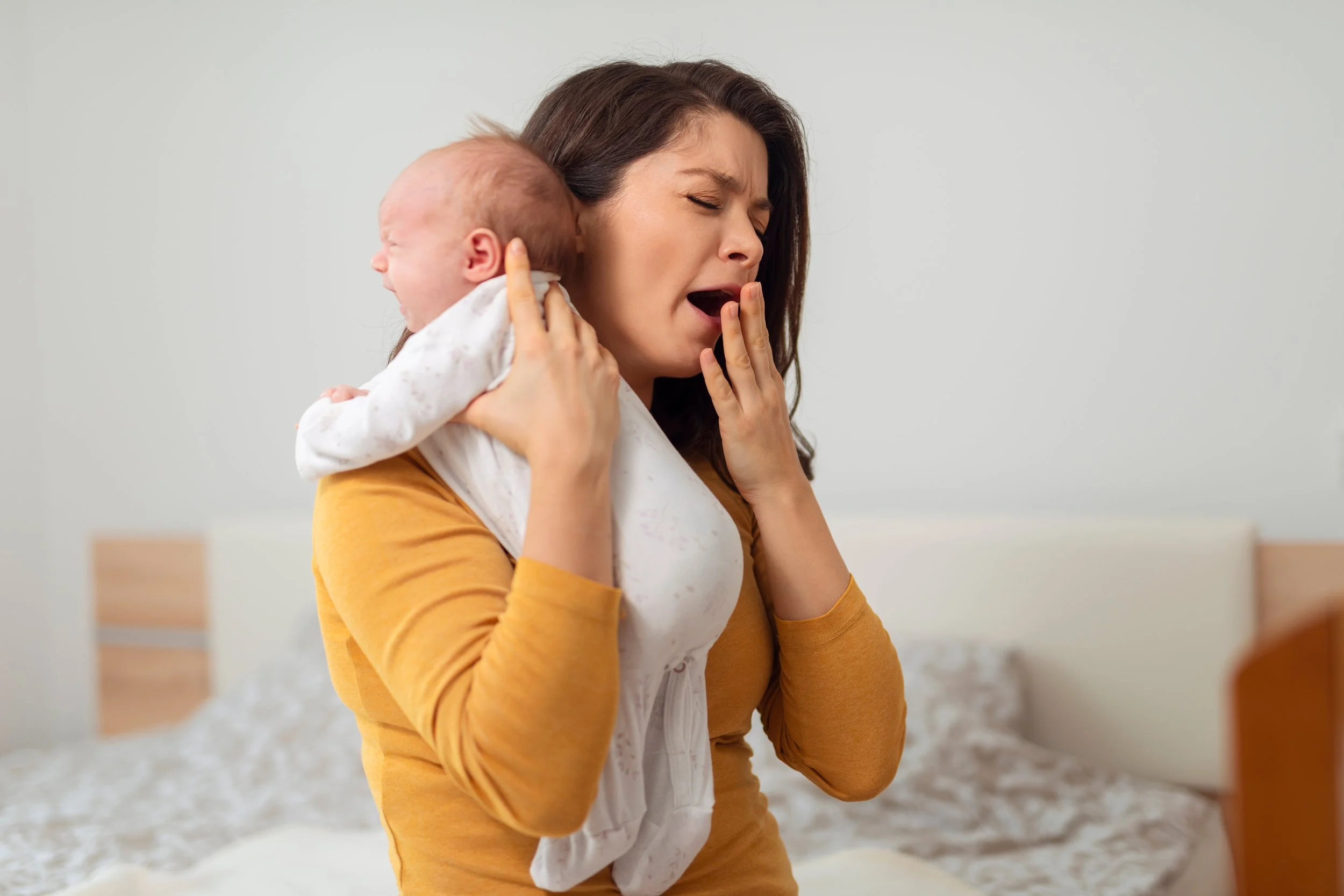 tired mom with newborn