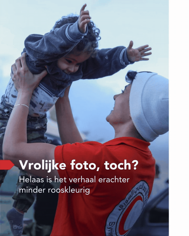 A joyful moment between a woman and a young boy. The woman, wearing a white beanie and red shirt with a logo, is holding the boy up in the air. The boy, dressed in a dark jacket and camouflage pants, is reaching out to the woman with a big smile.