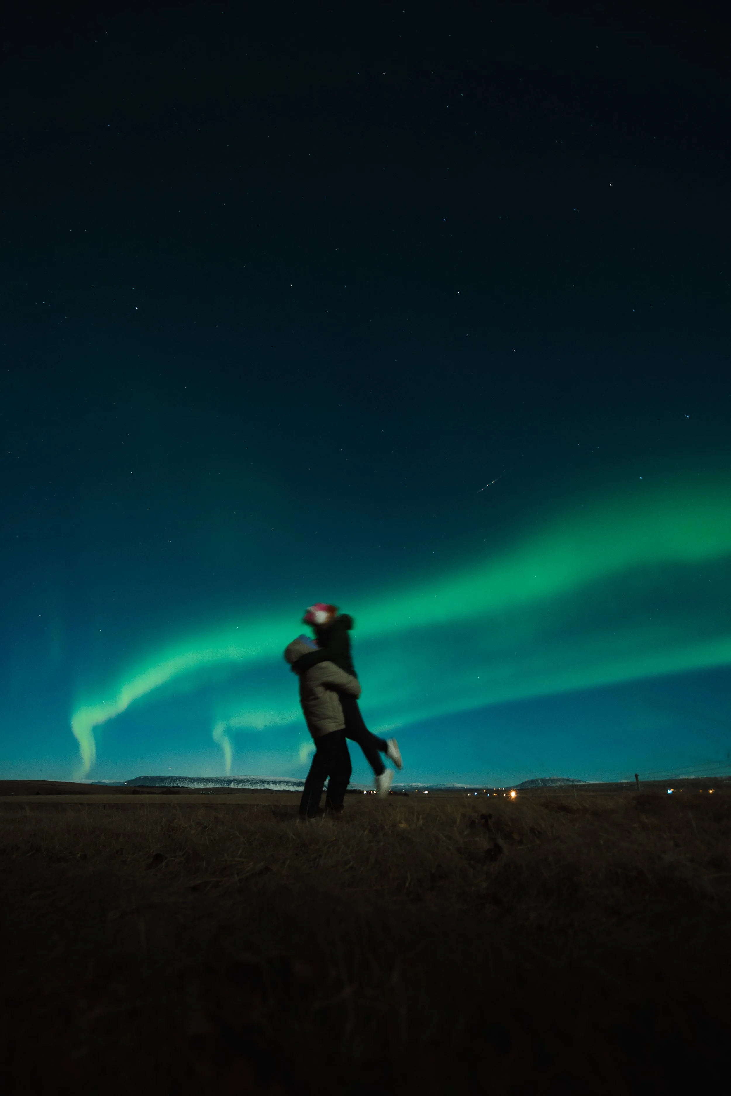Couple dancing under the northern lights in Iceland