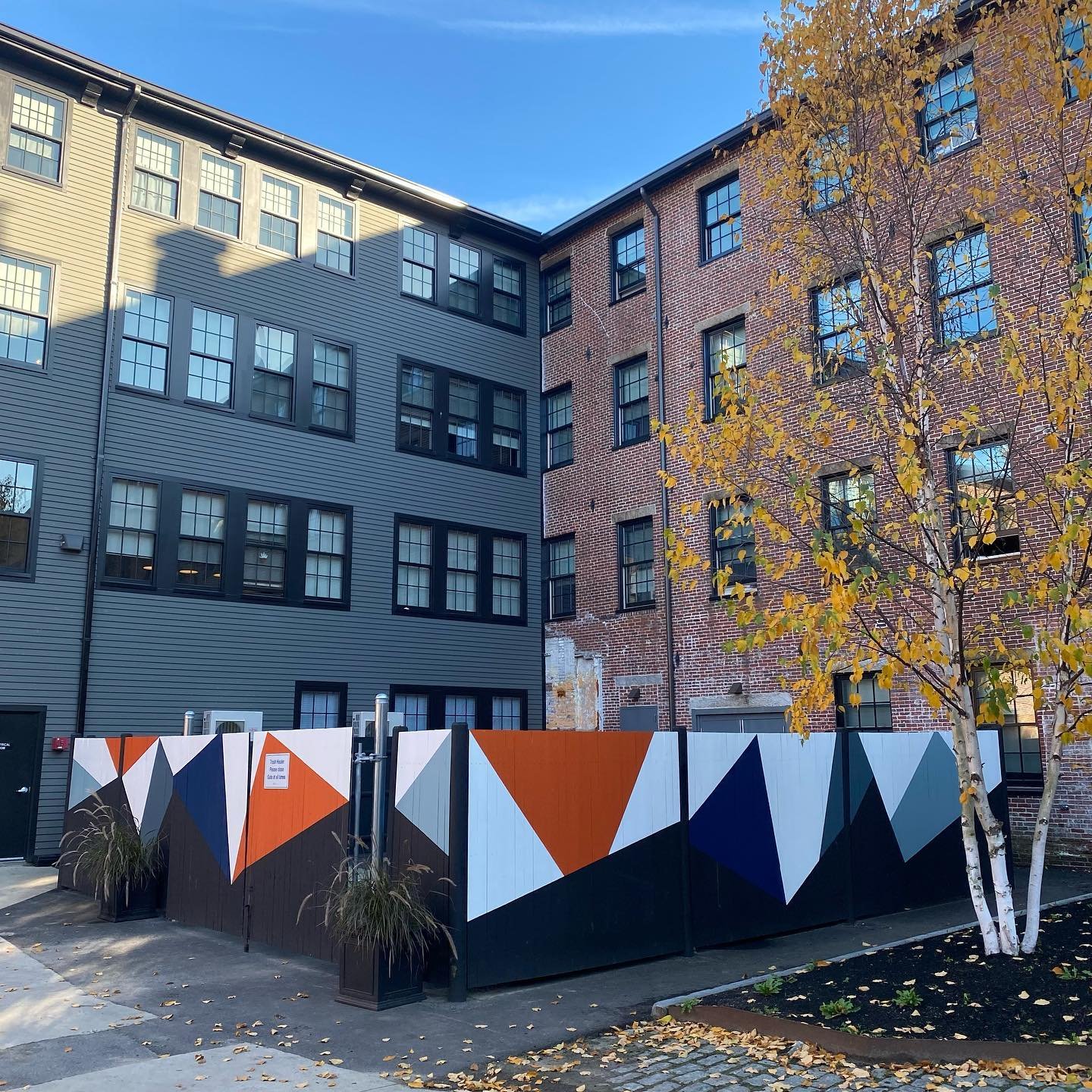 My very own first mural&hellip;on a dumpster surround fence! The River Dam Apartments at 28 Pearl Street in Biddeford had a small project of beautifying their fence in the adjacent courtyard and asked for help. I considered the fact that the 3.5&rdqu