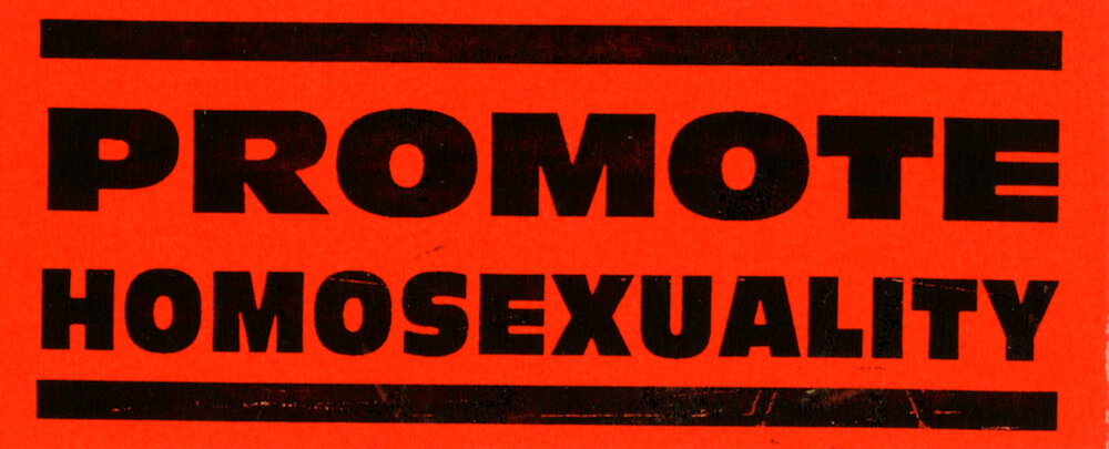 ​Queer Nation. "Promote Homosexuality,"c.early 1990s. Sticker. Judy Sisneros ACT UP/Los Angeles Records, ONE Archives at the USC Libraries.