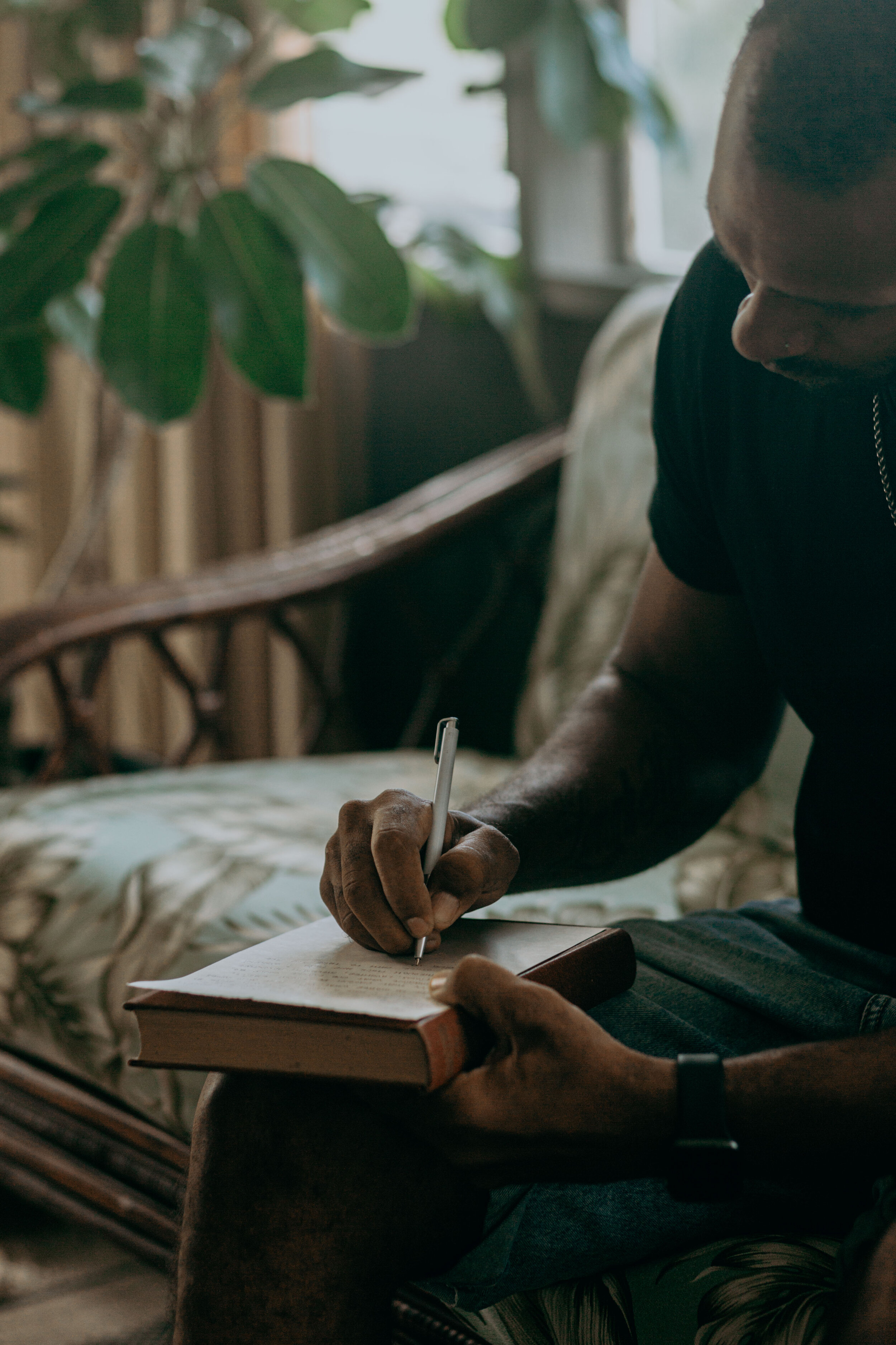 groom writing his vows close up in oahu for his elopement