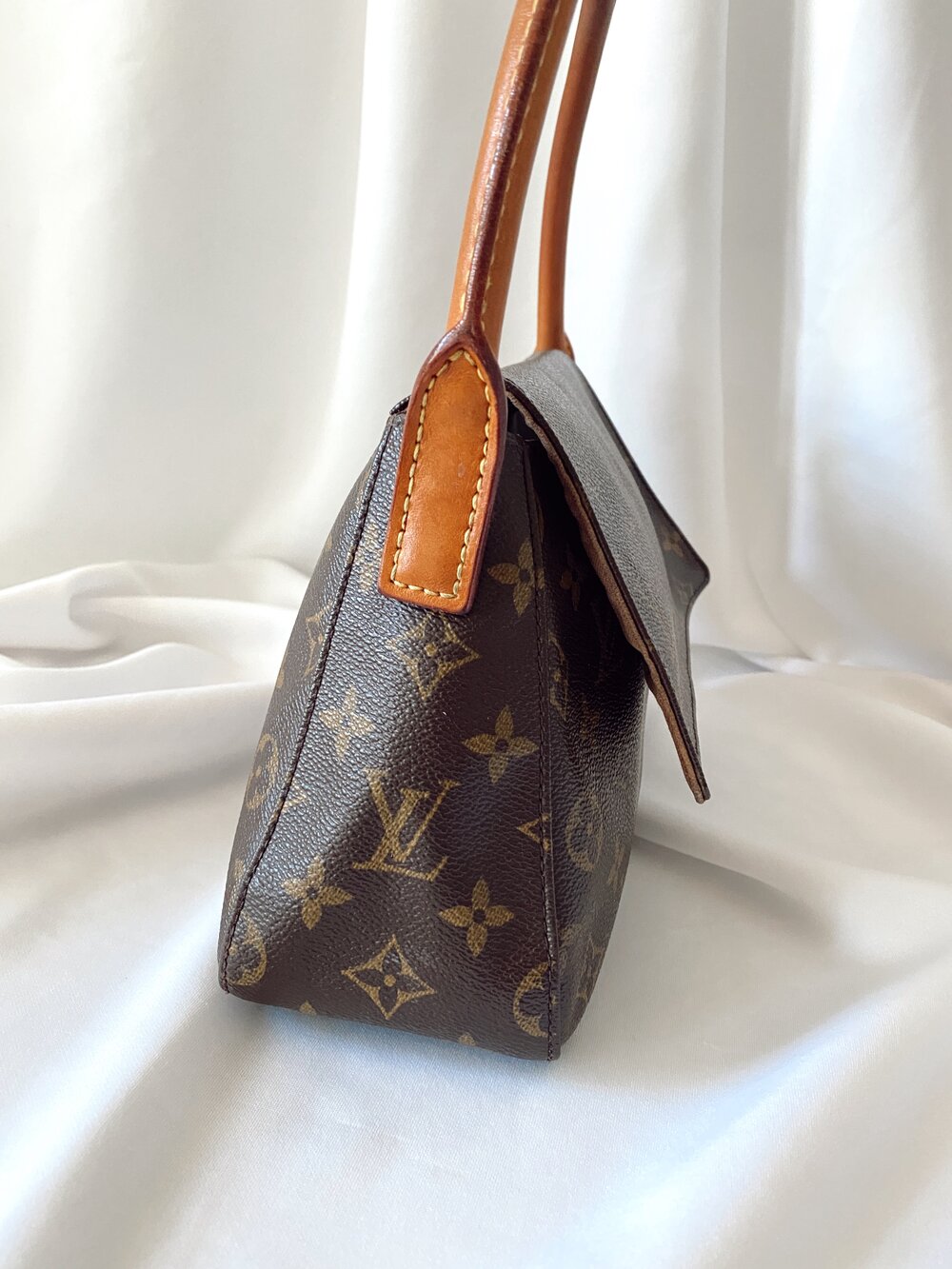 This vintage Louis Vuitton monogram mini looping bag