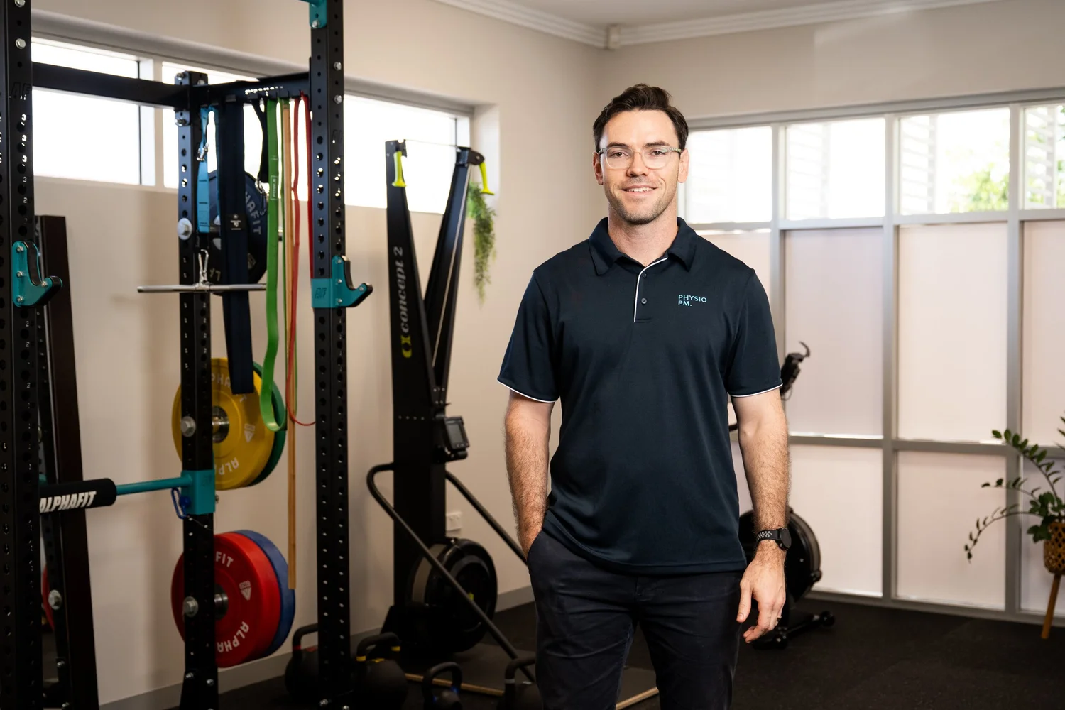 Mick McGovern, Townsville physiotherapist, standing in his Pimlico clinic