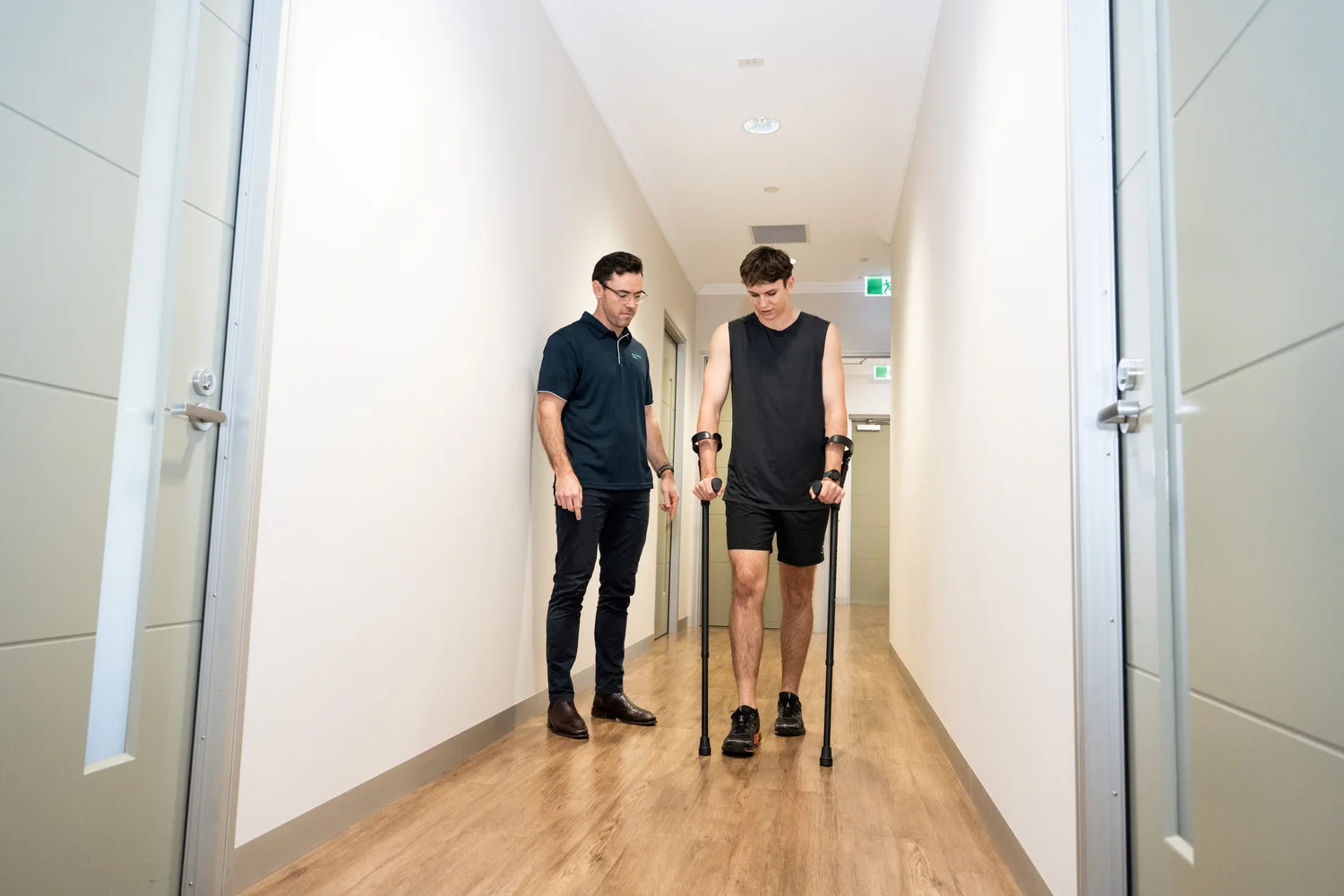 Mick supporting a runner through post-injury rehabilitation at the clinic