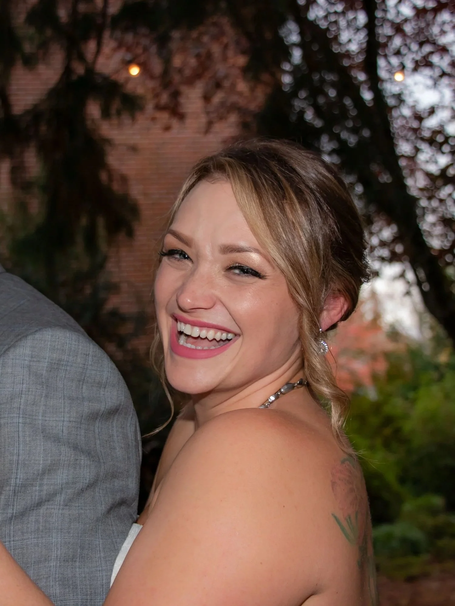 Woman facing camera laughing