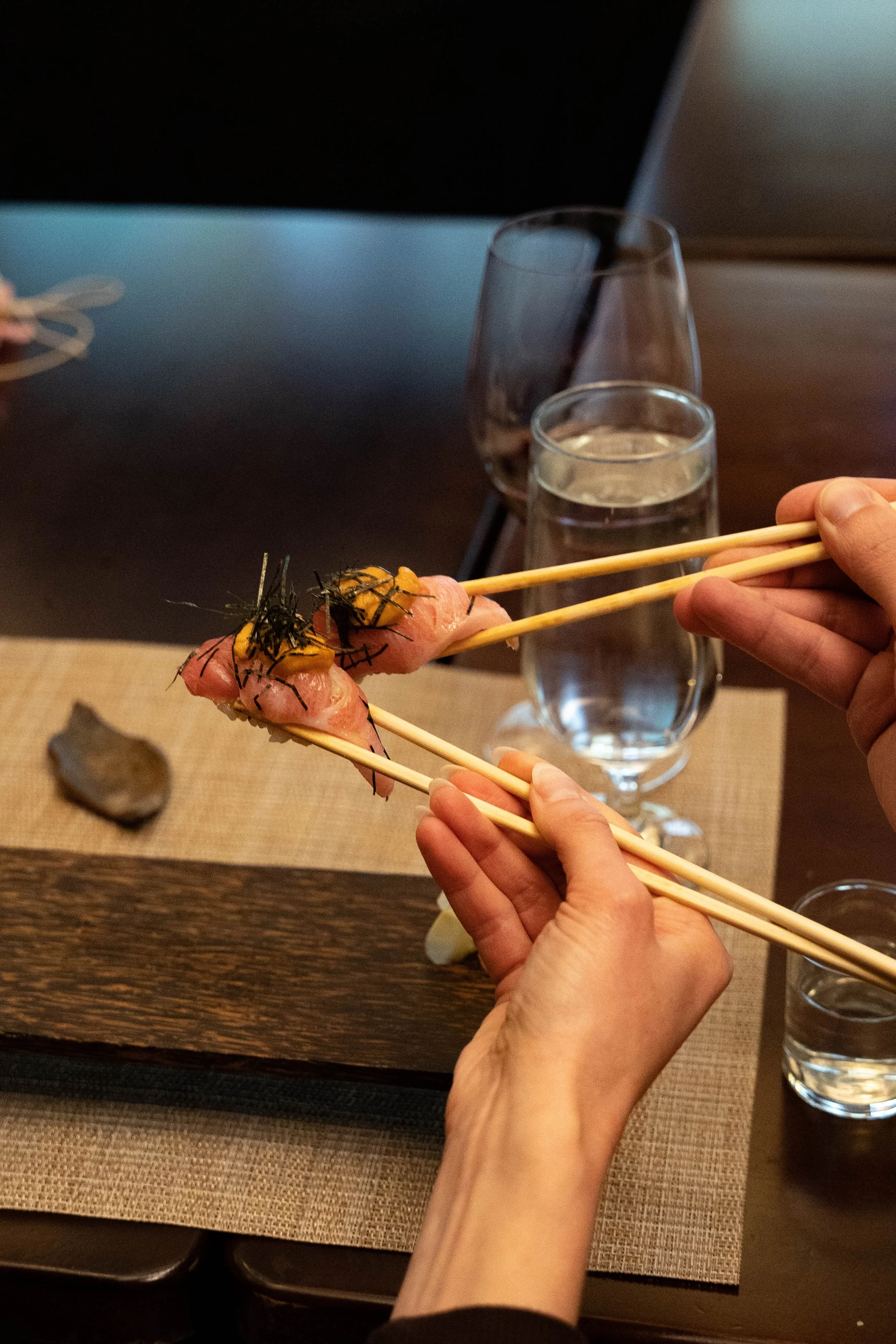 Group toasting sushi at Sora Cleveland