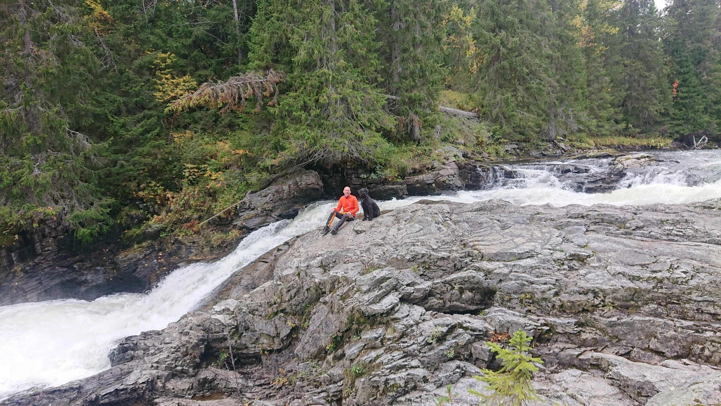 ﻿Dad and Uma by the waterfall.