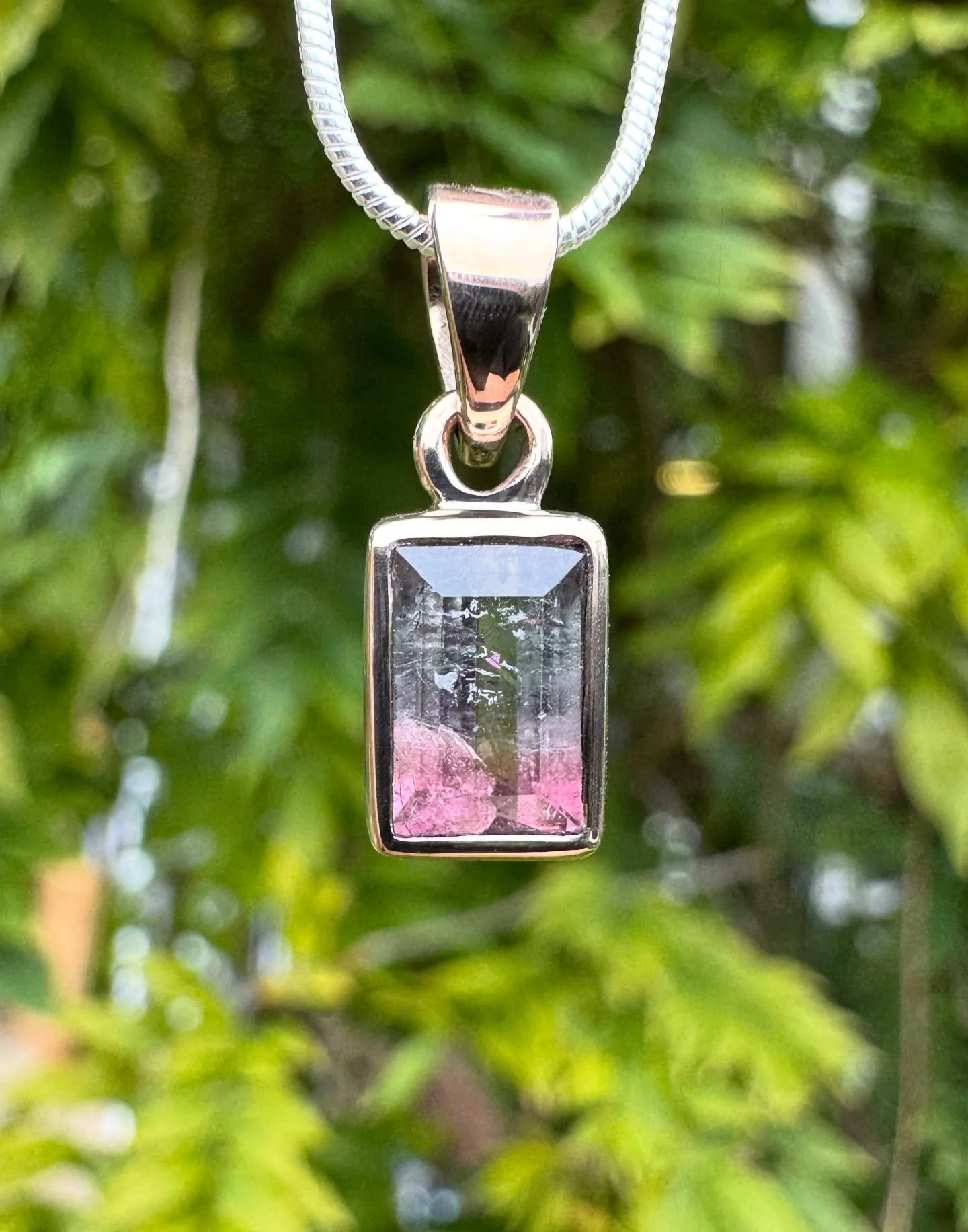 Fresh off the bench: a handmade 18ct grey gold pendant set with a natural watermelon tourmaline. 🍉✨

What makes this gem so fascinating are the inclusions within the crystal &mdash; tiny features formed during its natural growth process. These inclu