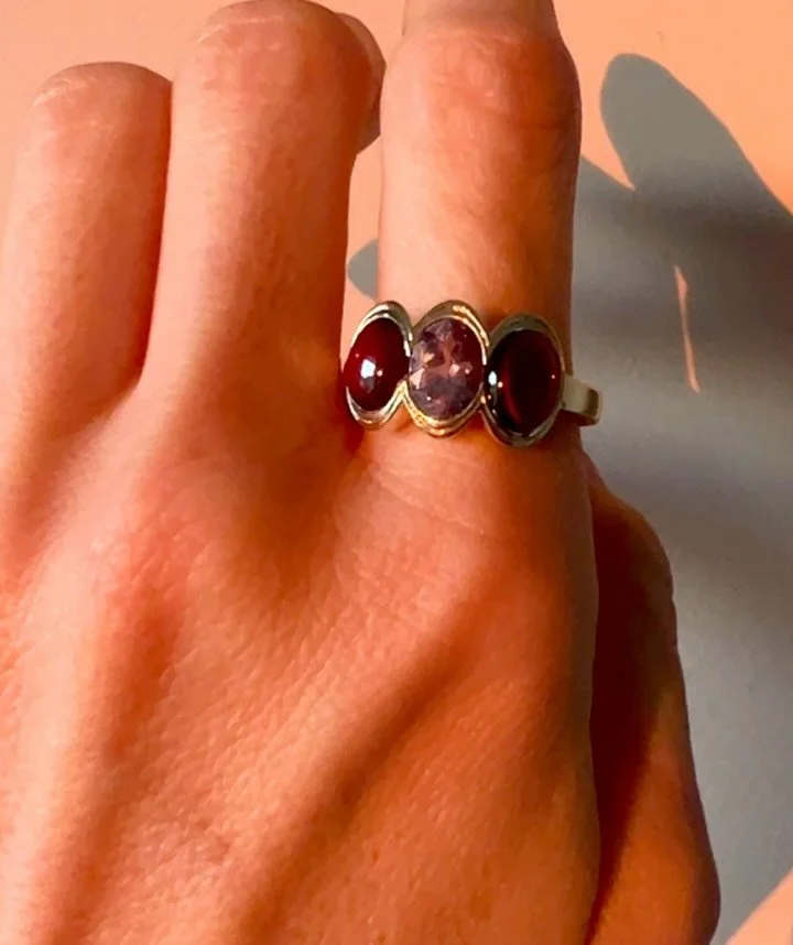 One of my favorite remodel projects. The garnet cabochons were removed from her silver earrings (last slide) and I sourced the lilac spinel to bring in some vibrancy. Love a purple and red pairing. &hearts;️💜&hearts;️
