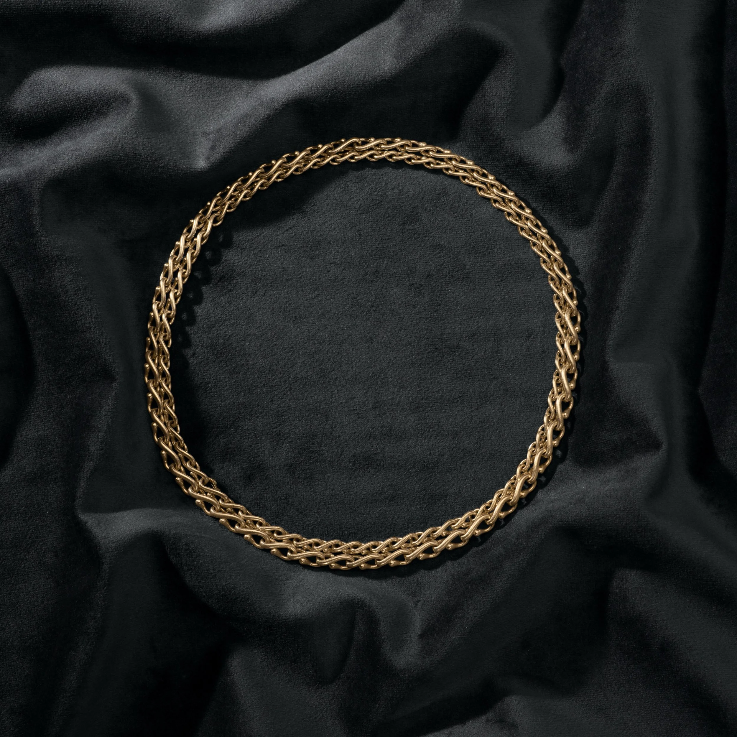 A chain that does it all. Handmade graduated links in solid 18kt yellow gold with two hidden clasps allow the necklace to be worn as one long piece, two separate stacked necklaces, a lariat (pendant can be clipped to the end), a luxuriously coiled br