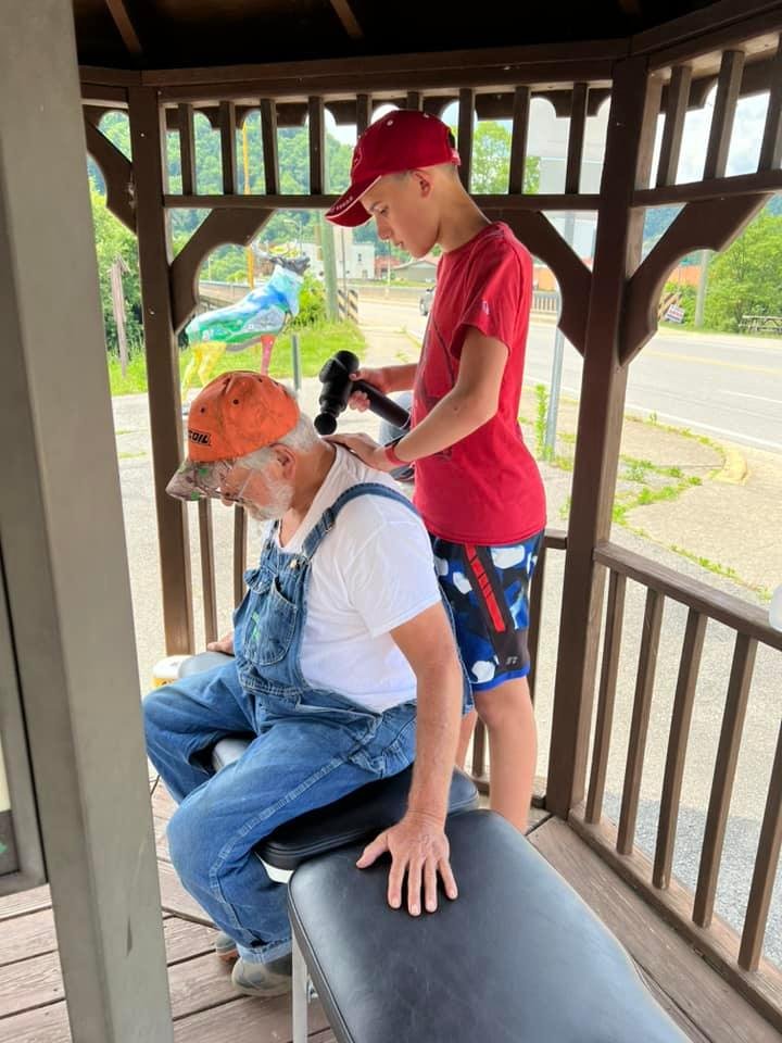 Evan with patient.jpg