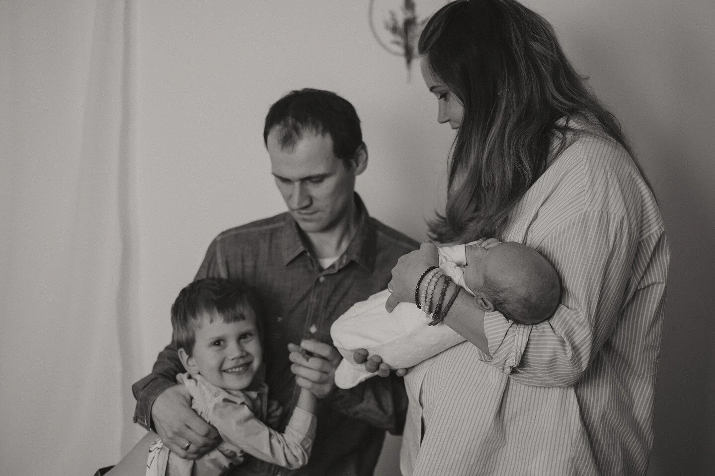 Should you choose studio or at home newborn photography?

When you start looking for a photographer, you'll find many different options and various styles. 
From a lifestyle photo shoot at home, to highly stylised studio shoot. 
So how do you begin t