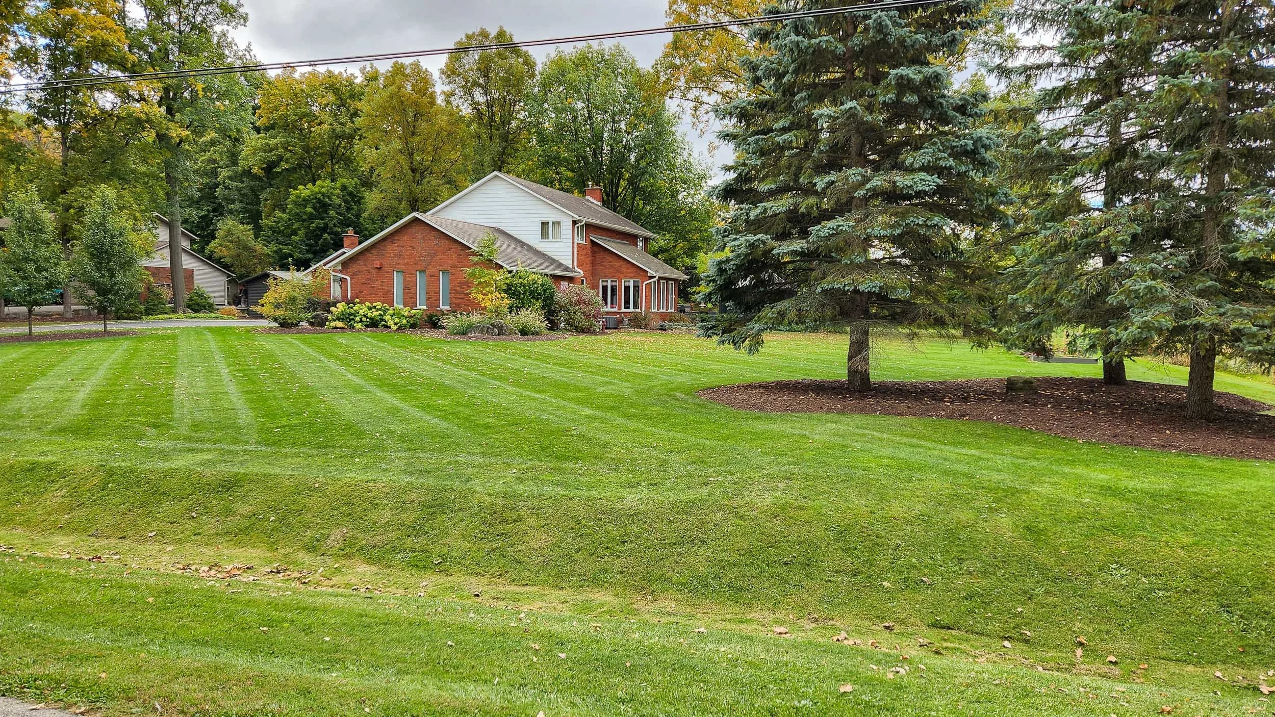 Spring lawn care and yard maintenance in Dunnville Ontario.