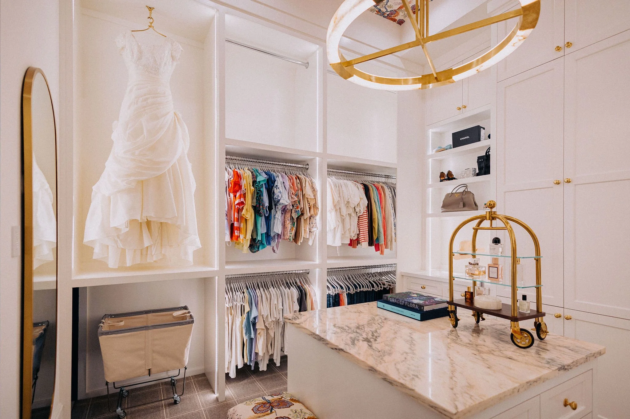 Luxury primary closet organization with custom storage and professional home organizing solutions