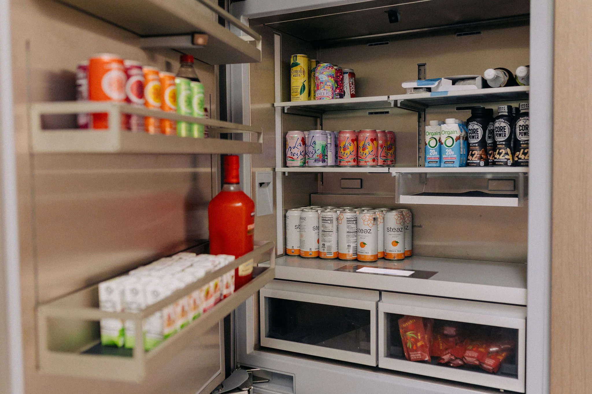 New construction pantry organized by a luxury moving concierge service with fully stocked and labeled systems