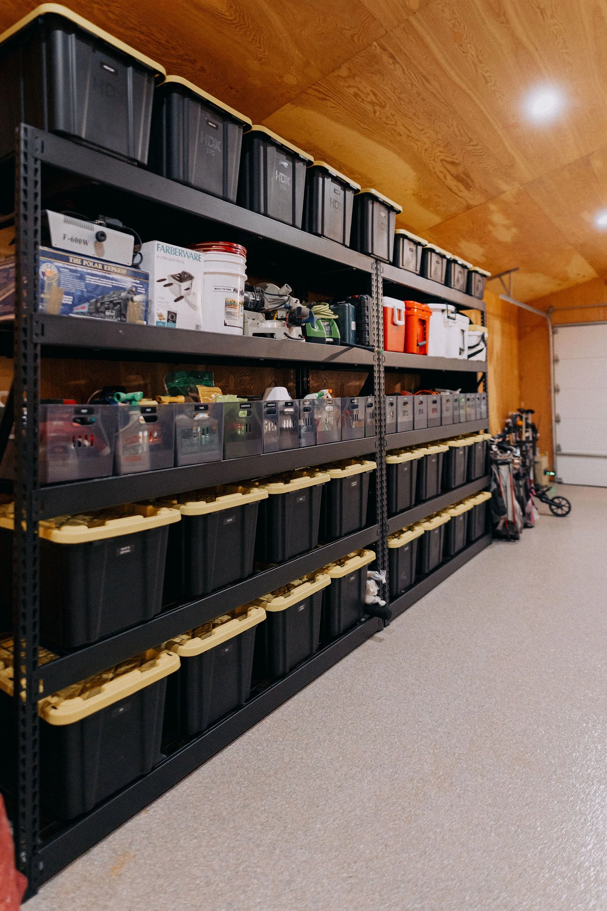 Garage organization with storage systems designed for functionality and clutter-free living