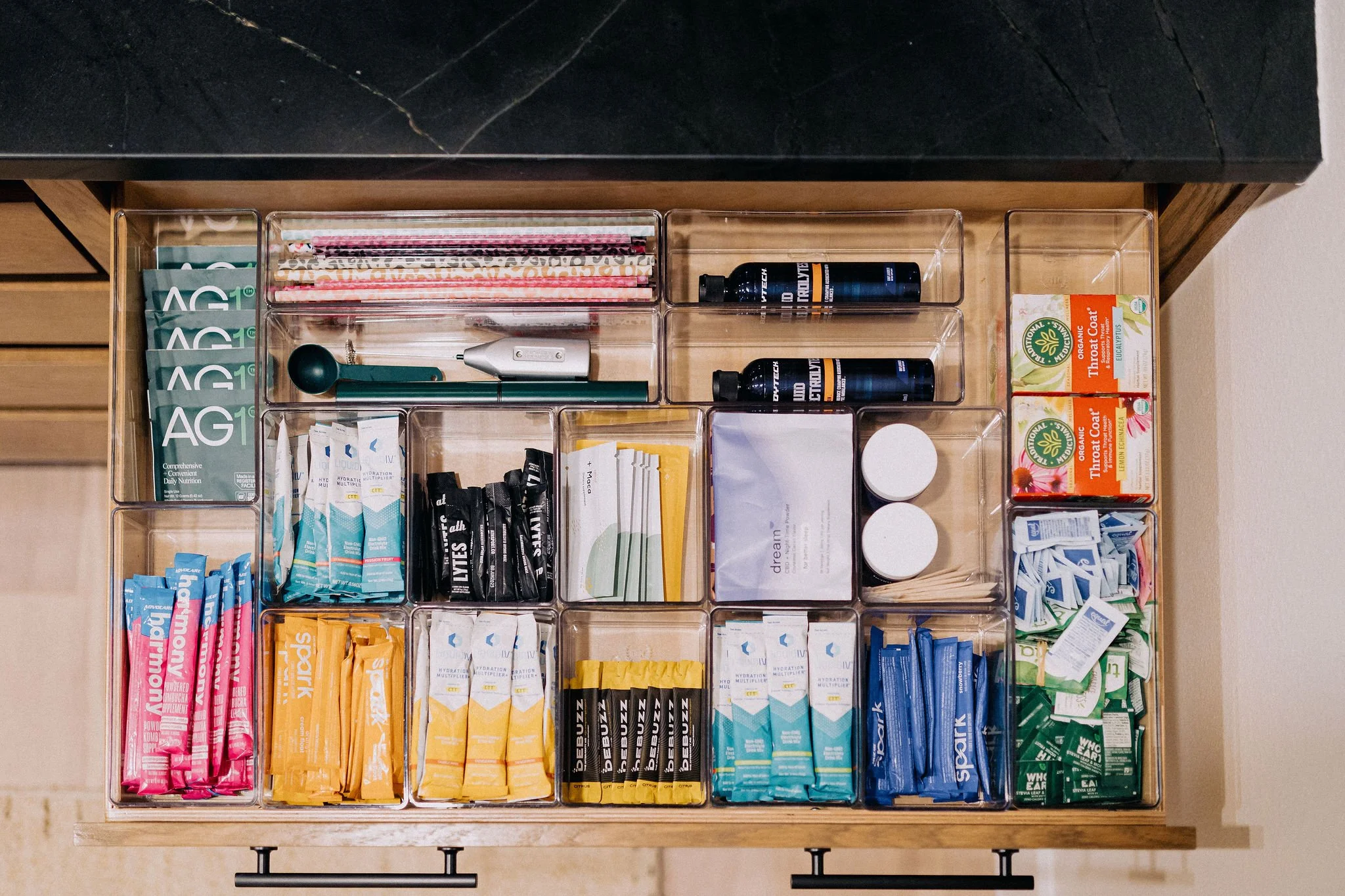 Luxury pantry drawer organization completed by a white glove moving and concierge relocation service