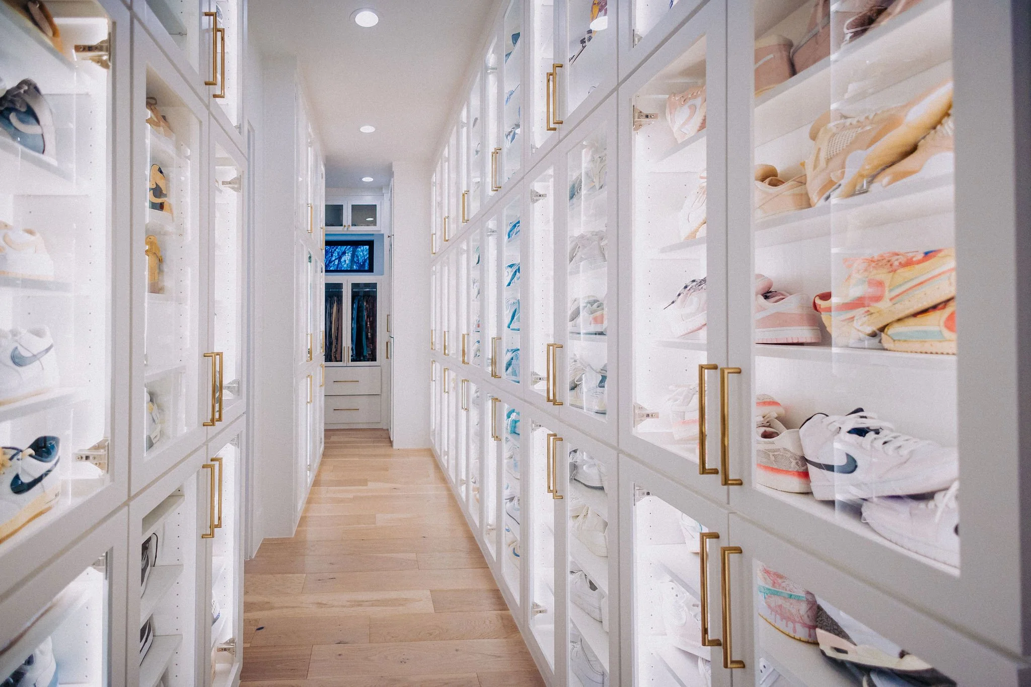 Custom luxury closet system installed by a concierge relocation service for a fully organized home