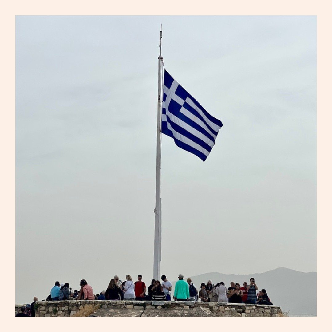 Located on the eastern part of the Acropolis is a viewing point, which gives a beautiful view of both the Acropolis and the surrounding city and terrain. The flag there even has a history.

When Germany took control of Athens, they ordered Knstantino