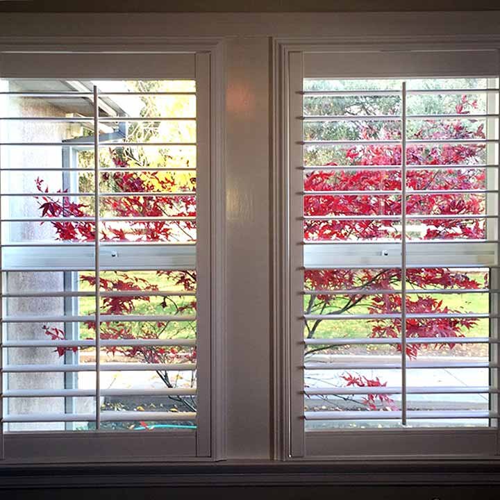 white-plantation-shutters-from-interior-looking-out.jpg