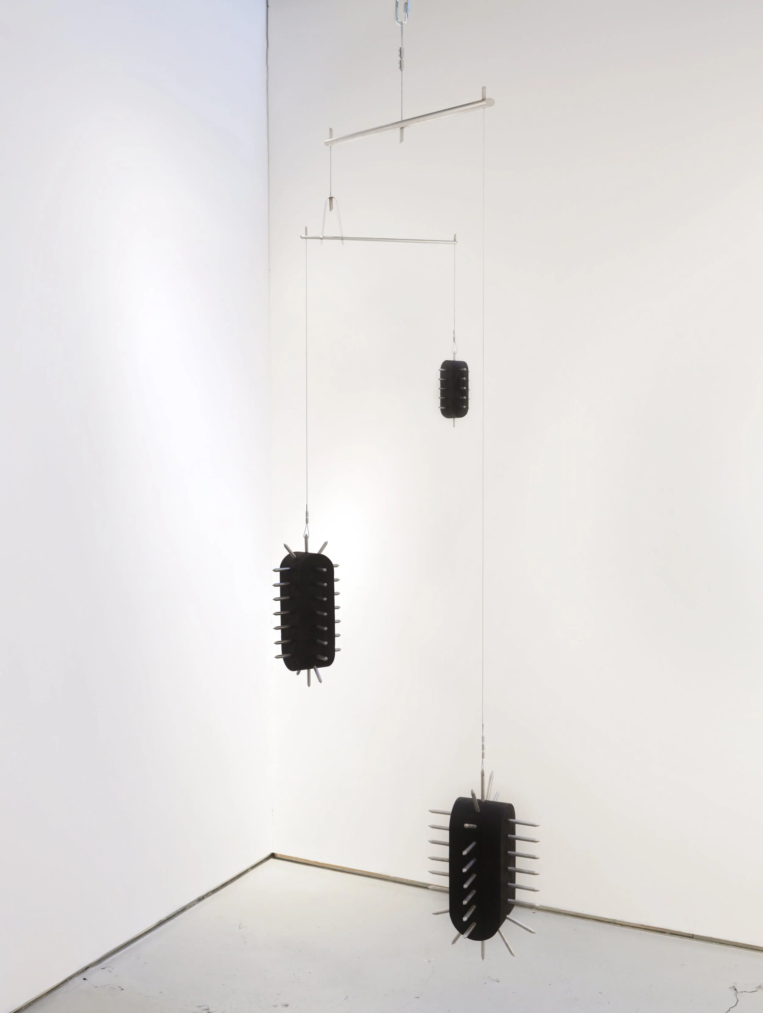 Too Many Bombs (2025) - 90”h x 30”w x 12”d - Stainless Steel, Ash & Wire - $16,000 CAD