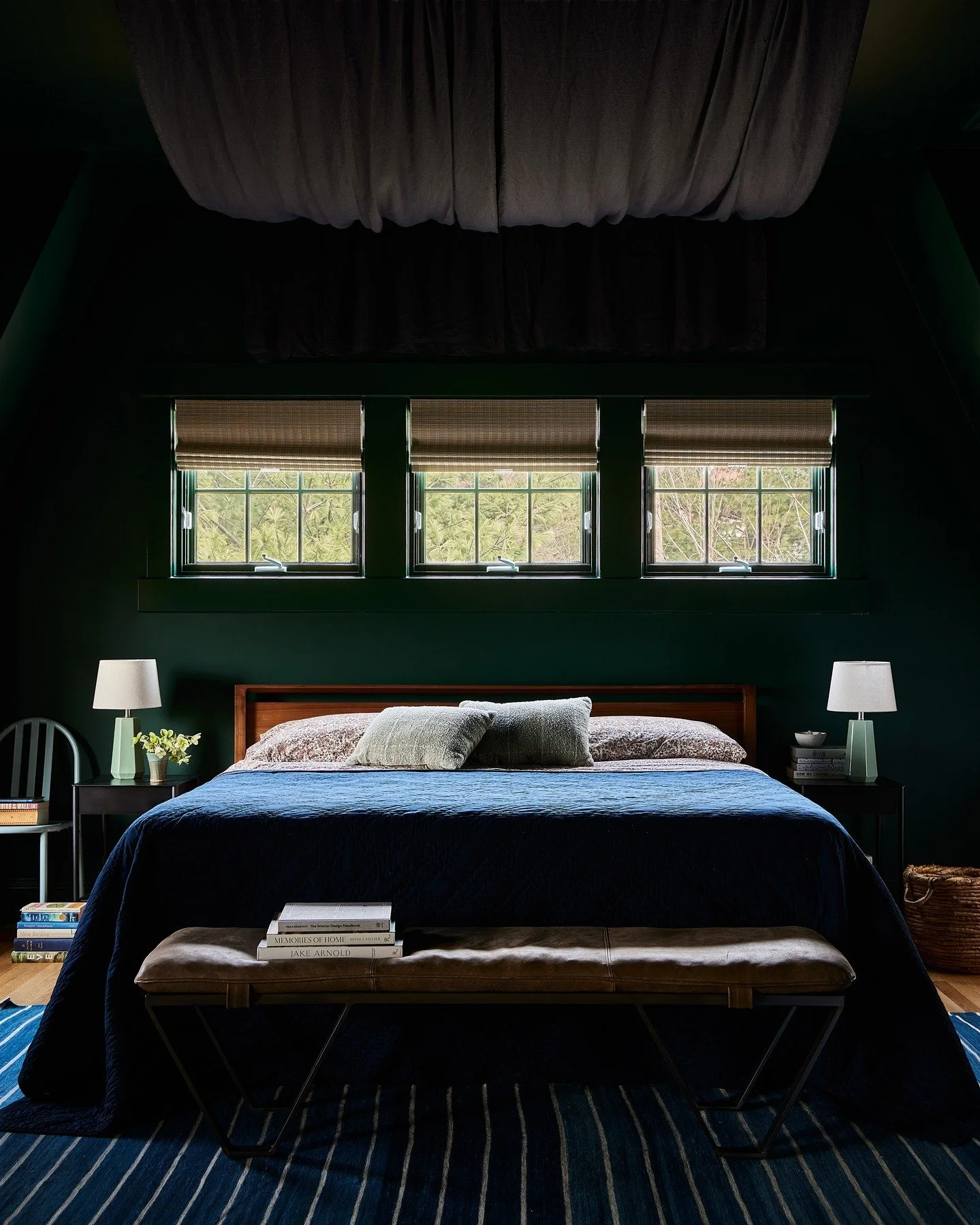 New year, new room: this time our primary bedroom, cozy and moody and many vibes away from where it started (swipe for before). The ceilings here are high with odd angles all over the place, so instead of fighting them, we softened the geometry&mdash