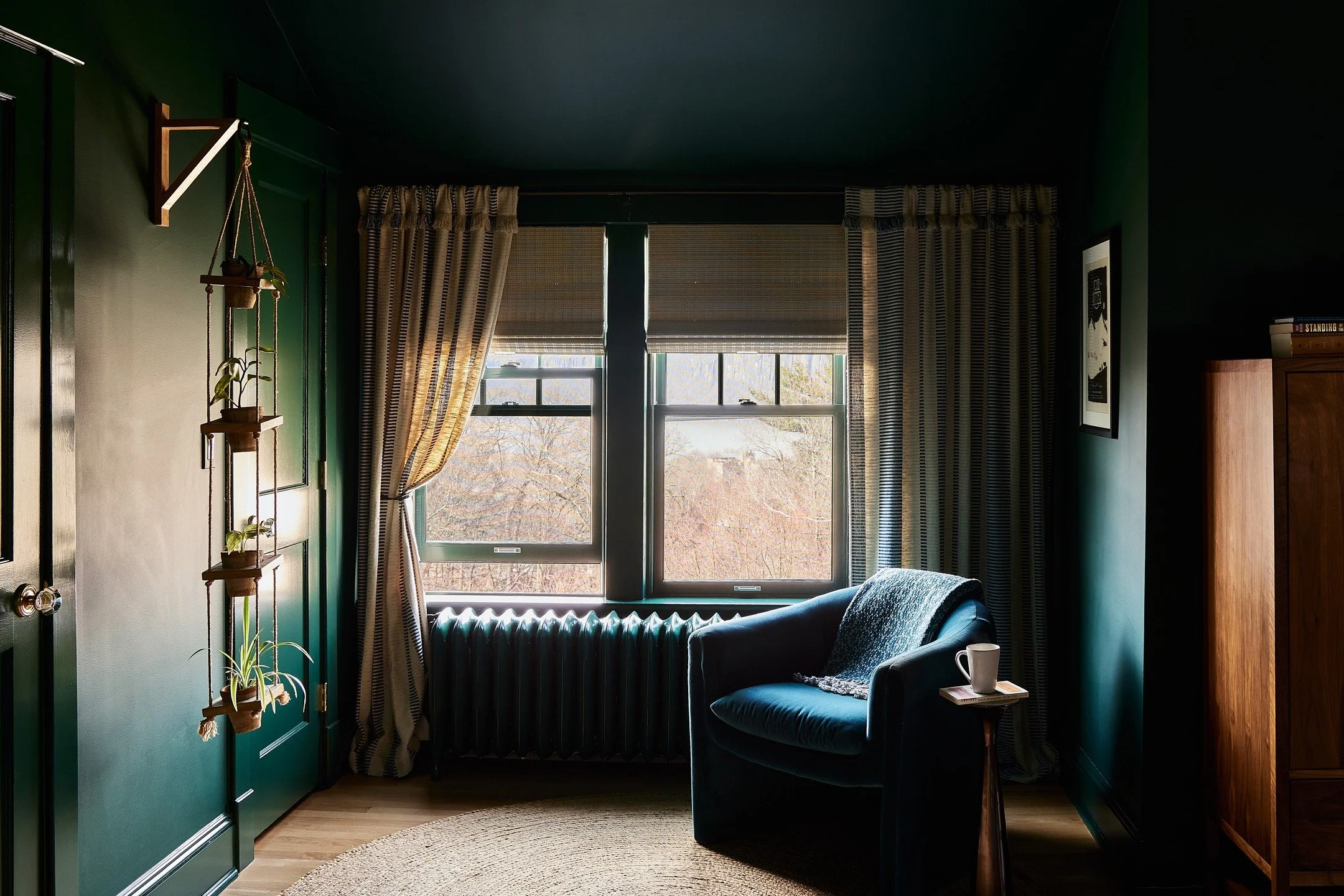 Looking at this snug corner of our old bedroom and realizing it could have been sponsored by @anthropologie. It evolved over time as our lives changed&mdash;once a rocking-chair baby-soothing zone, later a quiet spot to land&mdash;but I'm pretty sure