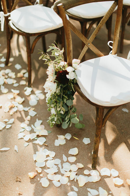 X-Back-Wedding-Ceremony-Chair-with-Floral-Adornment.jpeg
