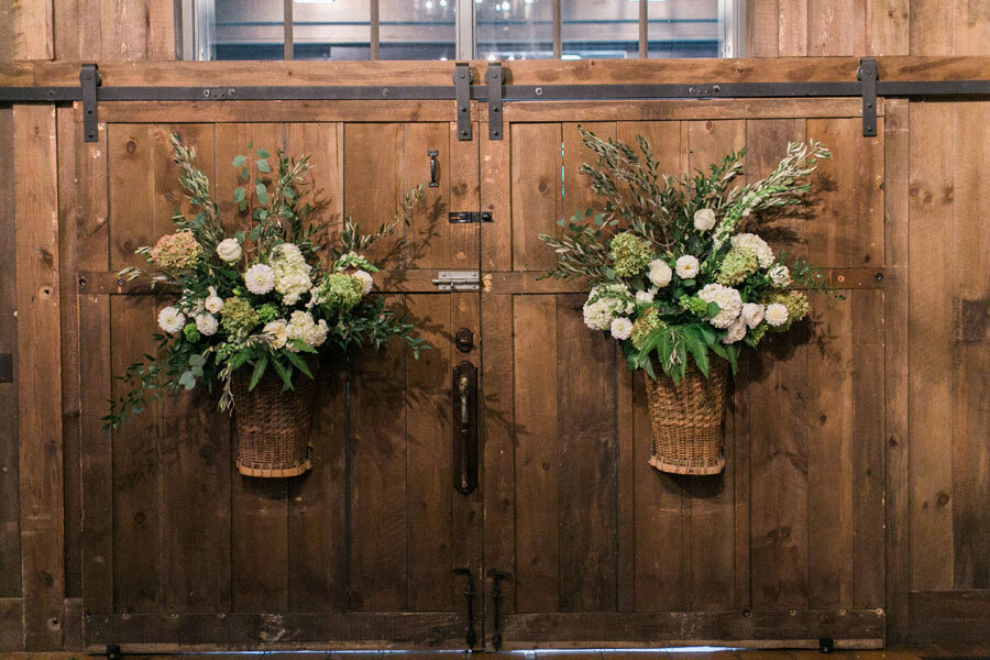 Floral-Barn-Door-Wedding-Arrangements.jpeg