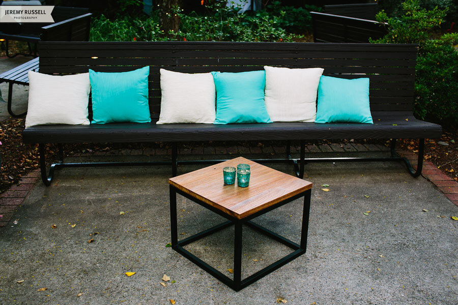 Jeremy-Russell-1407-Asheville-Event-Co-Biltmore-Wedding-Teal-and-White-Pillows-on-Bench.jpeg