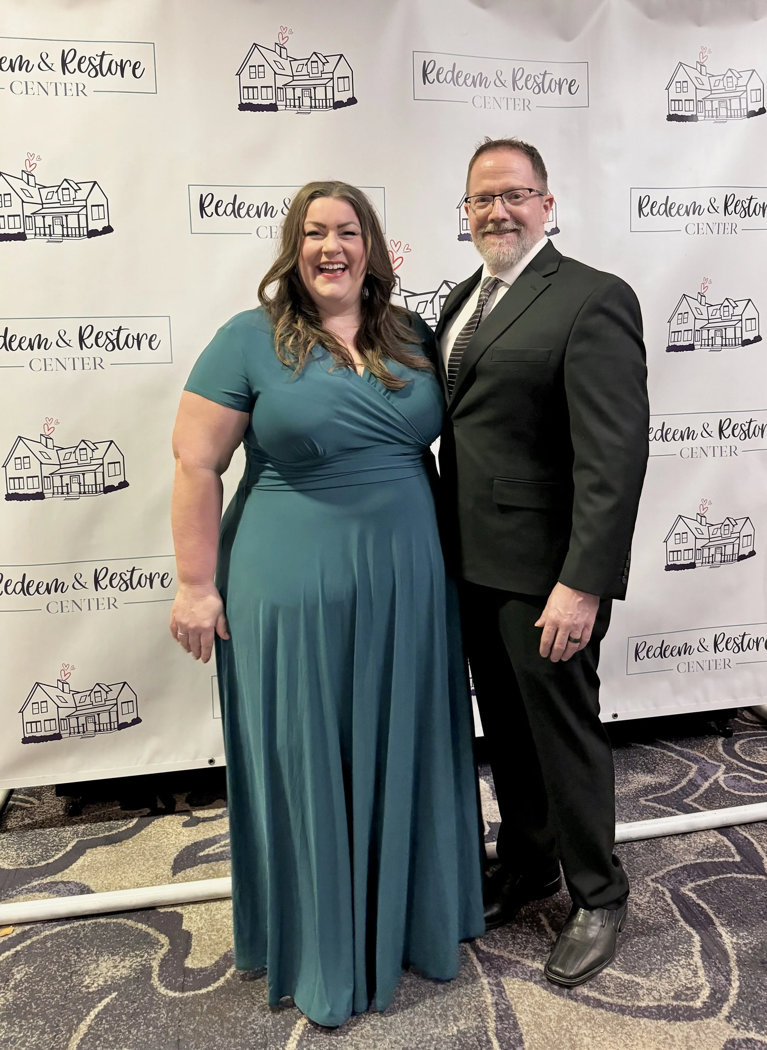 coach christine long teal dress with husband gala keynote speaker