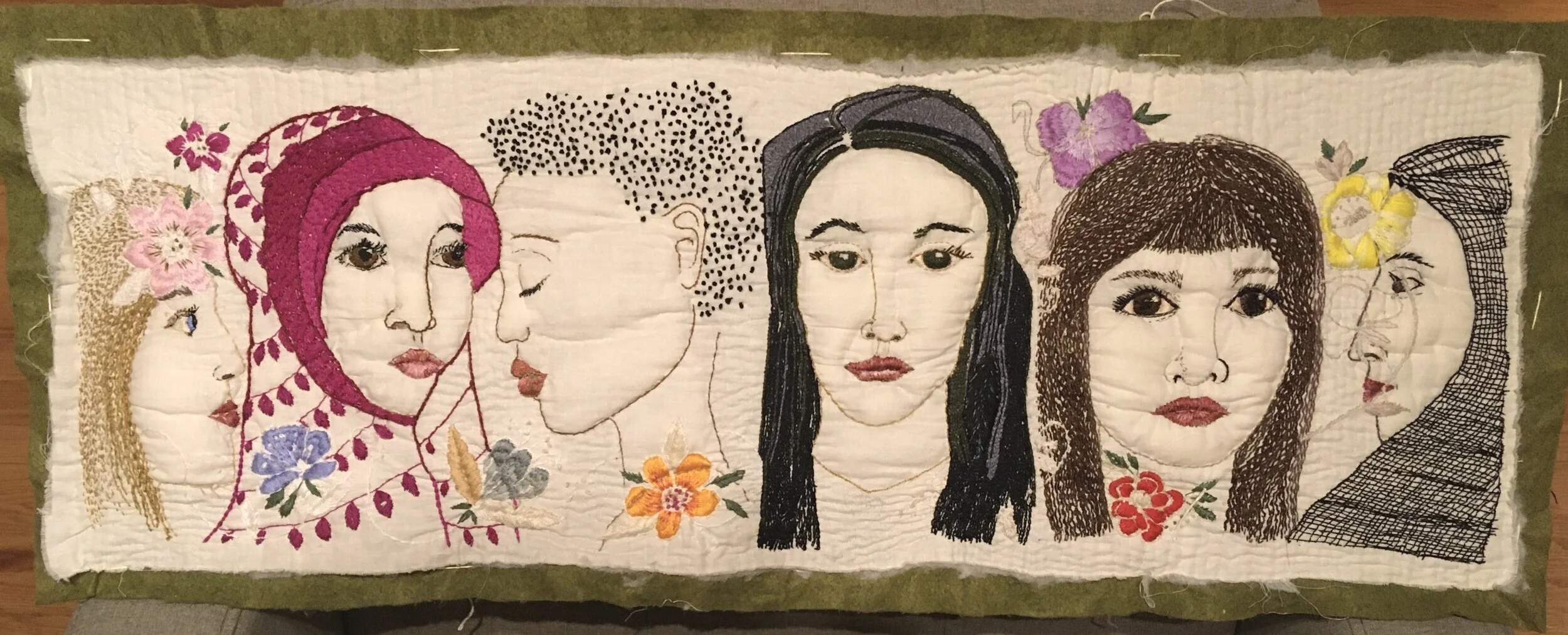 Resistance- embroidered and quilted, mounted on 35" x 13" board