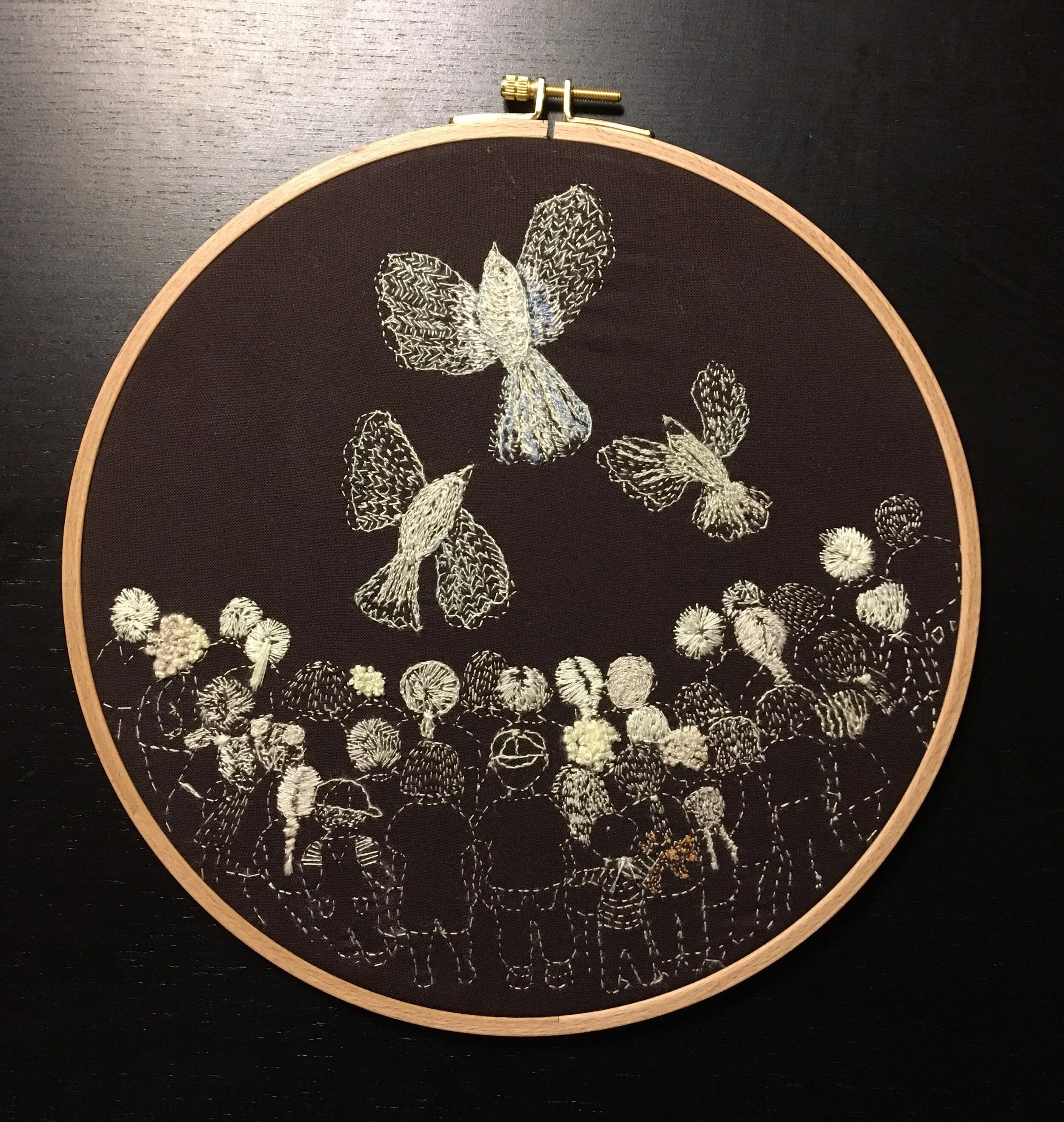 This piece was created and sold to raise money for attorney fees to help reunite children separated from their parents at the U.S. border.  12" hoop