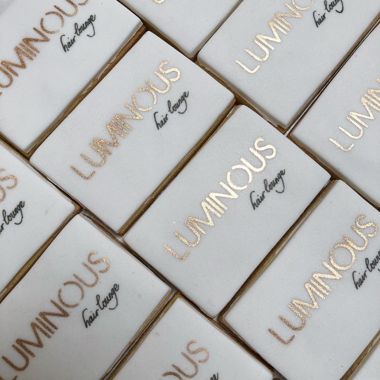 Love love love! how these custom logo cookies turned out for @luminoushairlounge ✨ Hand stencilled Rose gold 🌟